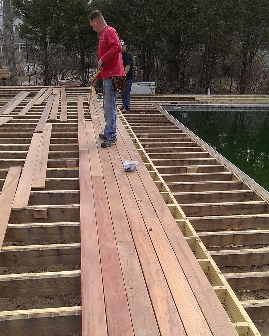 Deck boards being positioned