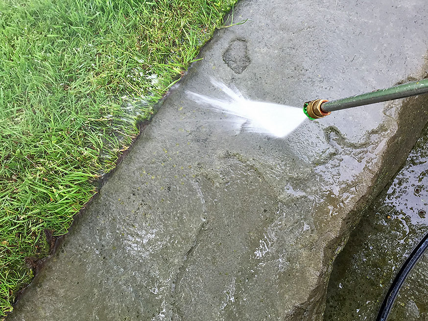 Patio being power washed