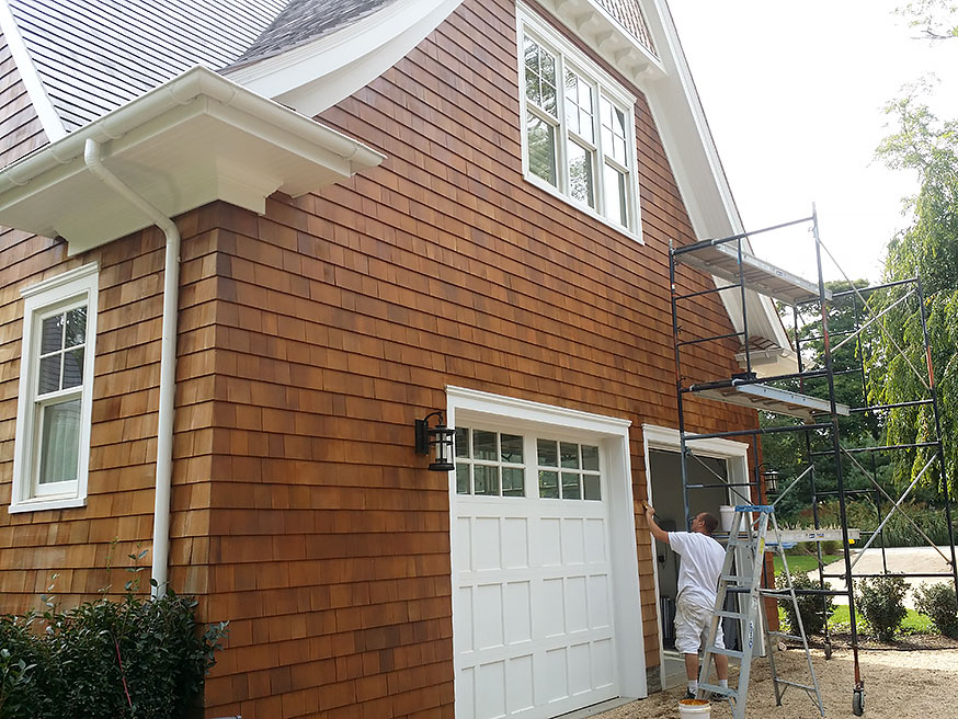 Cedar wood shingles being stained.