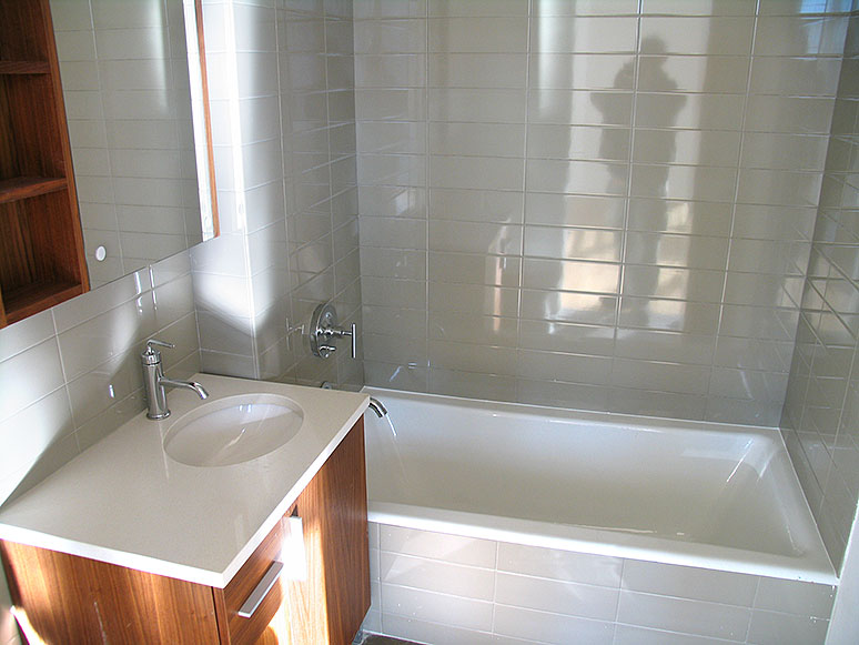 bathroom with ceramic tile walls