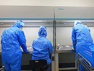 Medical workers in sterile room