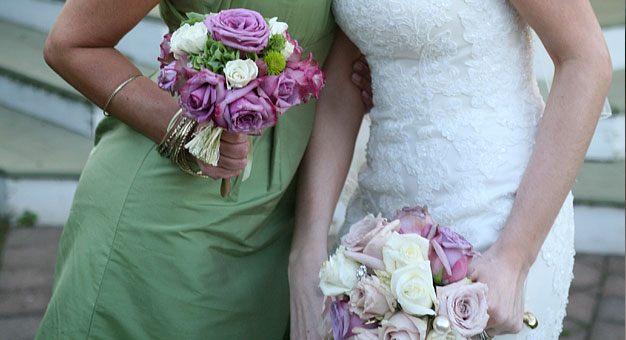 bride and bridesmaid with bouquets